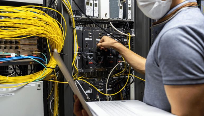 Network cables and server hardware illustrating leased line internet connectivity and high‑speed dedicated network.